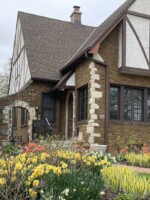 A tudor home in Wauwatosa is highlighted with hundreds of daffodil and tulips displays throughout the yard.